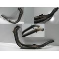 Auspuff-Krmmerrohre (fr Zylinder 2 und 3)<br>Zustand: Gebraucht mit Mangel<br><br>Verwendbar fr: Triumph Thunderbird, Typ: T309RT, Modelljahr: von 01/1995 bis 12/2003